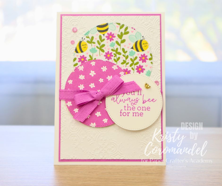 Card with layered patterned paper circles and bee-themed print