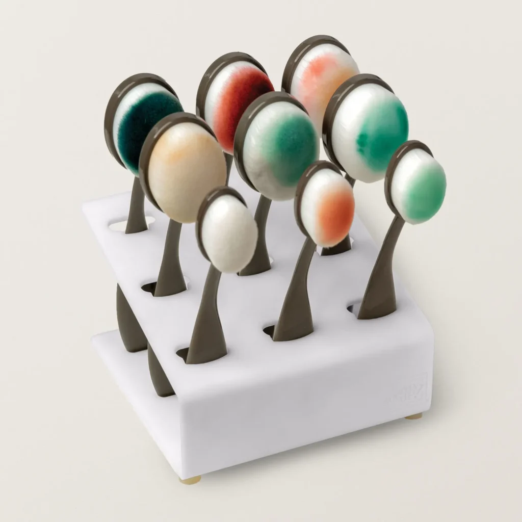 Set of colour-tipped ink blending brushes stored upright in a white rack, ready for paper crafting projects.