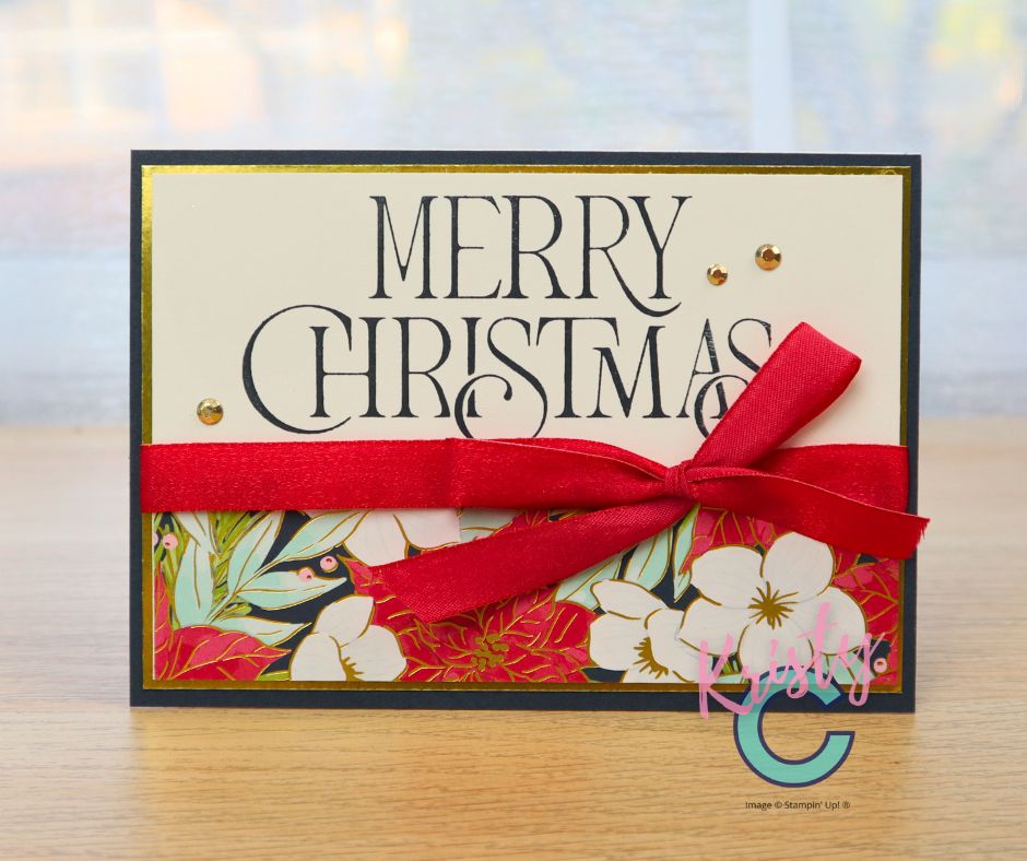 Handmade horizontal Christmas card with bold ‘Merry Christmas’ sentiment and red ribbon accent.”