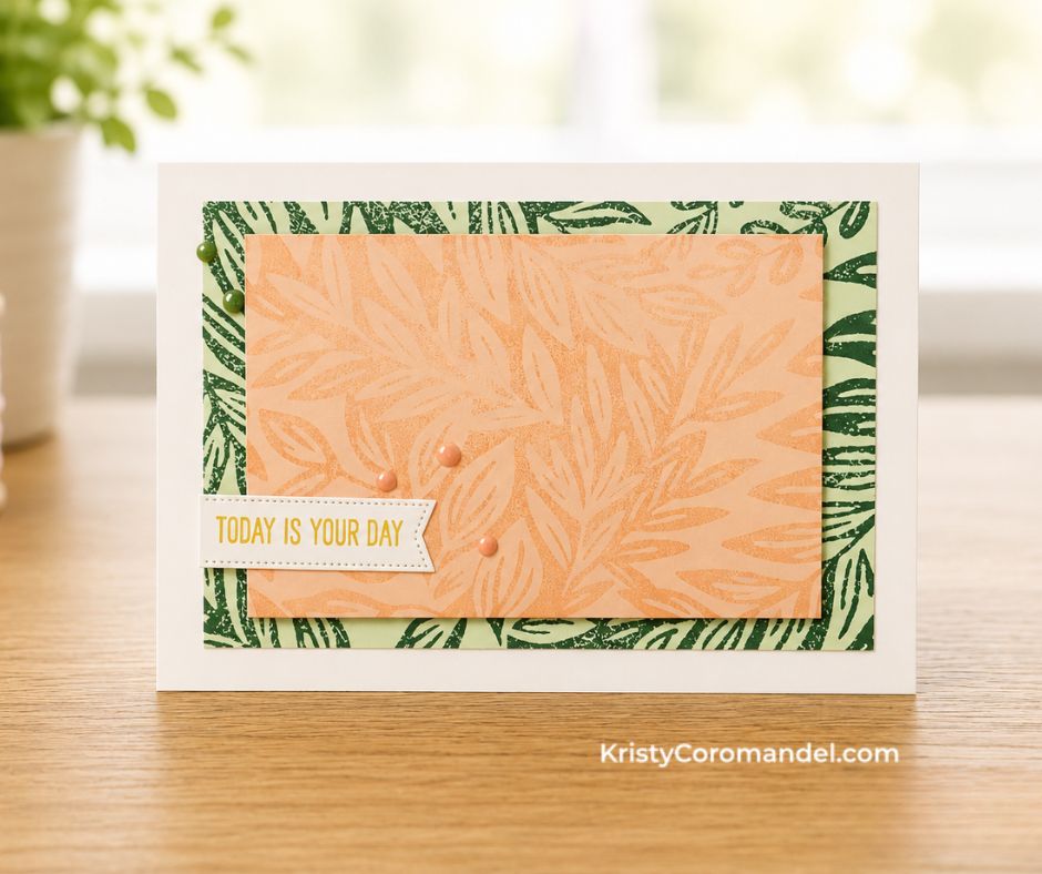 Handmade blue greeting card featuring the Moody Leaves Background Stamp in monochromatic blue tones with a layered white stitched circle sentiment, die-cut foliage accents and white twine on a white card base.