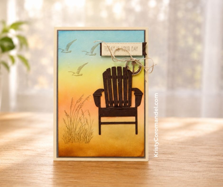 Handmade card featuring a softly blended sunset-to-sky background, stamped waterside grasses and seagulls, and a dark die-cut Adirondack chair as the focal point, made with the Stampin' Up! Relaxing Waterside Bundle.