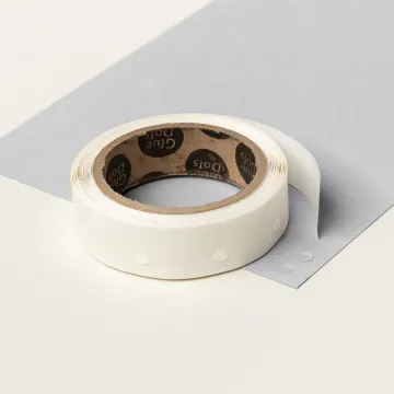 Roll of Glue Dots adhesive for attaching small embellishments and ribbon to handmade cards